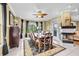 Elegant dining room featuring a fireplace, ceiling fan, and a wooden table with seating for six at 2369 Clandon Dr., Myrtle Beach, SC 29579