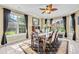 Elegant dining room filled with natural light from the many windows, and includes a wooden table with seating for six at 2369 Clandon Dr., Myrtle Beach, SC 29579