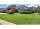 Beautifully landscaped lawn with mature shrubs and flowering plants surrounding a well-maintained home at 2369 Clandon Dr., Myrtle Beach, SC 29579