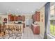 Bright kitchen featuring granite countertops, tile floors, stainless steel appliances, and a breakfast bar with seating at 2369 Clandon Dr., Myrtle Beach, SC 29579