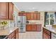Bright kitchen featuring granite countertops, stainless steel appliances, tile floors, and plenty of cabinet space at 2369 Clandon Dr., Myrtle Beach, SC 29579