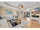 Spacious living room with hardwood floors, tray ceiling, modern decor, and comfortable furnishings at 2369 Clandon Dr., Myrtle Beach, SC 29579