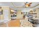 Inviting living room featuring hardwood floors, tray ceiling, a fireplace and an open concept design at 2369 Clandon Dr., Myrtle Beach, SC 29579