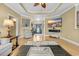 Open-concept living space with hardwood floors, fireplace, tray ceiling, and stylish decor at 2369 Clandon Dr., Myrtle Beach, SC 29579