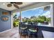 A covered outdoor kitchen area with bar seating and a view of the pool area is perfect for entertaining at 2369 Clandon Dr., Myrtle Beach, SC 29579
