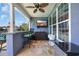 Outdoor patio space with a ceiling fan, bar seating, and a TV at 2369 Clandon Dr., Myrtle Beach, SC 29579