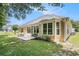 Backyard with patio, lawn, and well-maintained landscaping on a sunny day at 2510 Oriole Dr., Murrells Inlet, SC 29576