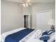 Cozy bedroom features ceiling fan, closet, and blue and white bedding at 2510 Oriole Dr., Murrells Inlet, SC 29576