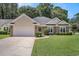 Charming single-story home with brick accents, manicured lawn, and two-car garage on a sunny day at 2510 Oriole Dr., Murrells Inlet, SC 29576