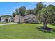Well-maintained home featuring lush green lawn, mature landscaping, and classic brick detailing at 2510 Oriole Dr., Murrells Inlet, SC 29576