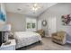 Comfortable bedroom with neutral walls, carpet flooring, ceiling fan, and natural light from a window at 2510 Oriole Dr., Murrells Inlet, SC 29576