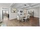 Stylish dining area with an open layout, seamlessly connecting to the living room and kitchen for easy entertaining at 264 Switchgrass Loop, Little River, SC 29566