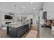 Open kitchen design showcasing a large island with granite countertops, stainless steel appliances, and modern pendant lighting at 264 Switchgrass Loop, Little River, SC 29566