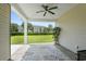 Relaxing patio with a ceiling fan, offering an outdoor living space with a view of the community at 264 Switchgrass Loop, Little River, SC 29566