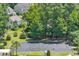 Aerial shot of community basketball court with palm trees and benches surrounded by lush green landscaping at 2685 Scarecrow Way, Myrtle Beach, SC 29579