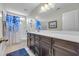 Bathroom showcasing a spacious countertop, dark cabinets, and a shower with blue accents at 2685 Scarecrow Way, Myrtle Beach, SC 29579