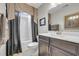 Bathroom featuring dark wood cabinets, a white countertop, and a shower-tub combo at 2685 Scarecrow Way, Myrtle Beach, SC 29579