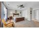 Bright bedroom with a ceiling fan, ample closet space, and natural light at 2685 Scarecrow Way, Myrtle Beach, SC 29579
