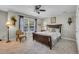 Comfortable bedroom with a ceiling fan, carpet flooring, and a relaxing ambiance at 2685 Scarecrow Way, Myrtle Beach, SC 29579