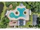 Overhead view of a community pool featuring unique design, seating, playground, and lush greenery around the area at 2685 Scarecrow Way, Myrtle Beach, SC 29579