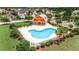Community pool area with unique heart shape design, surrounded by mature landscaping with a nearby barn at 2685 Scarecrow Way, Myrtle Beach, SC 29579