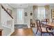 Inviting foyer with beautiful floors, stairs, chairs, and a front door at 2685 Scarecrow Way, Myrtle Beach, SC 29579
