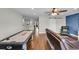 Spacious game room with air hockey table, comfortable seating, and hard flooring at 2685 Scarecrow Way, Myrtle Beach, SC 29579