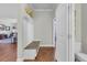 Hallway featuring coat rack with bench and an open doorway to a bathroom at 2685 Scarecrow Way, Myrtle Beach, SC 29579