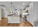 Open kitchen with an island, granite countertops, stainless steel appliances, and access to the dining area at 2685 Scarecrow Way, Myrtle Beach, SC 29579