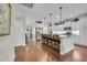 Spacious kitchen featuring hardwood floors, an island with bar seating, and stainless steel appliances at 2685 Scarecrow Way, Myrtle Beach, SC 29579
