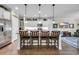 Bright, open kitchen featuring an island with bar stool seating and stainless steel appliances at 2685 Scarecrow Way, Myrtle Beach, SC 29579