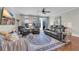Spacious living room showcasing a ceiling fan, hardwood floors, and sliding doors to the backyard at 2685 Scarecrow Way, Myrtle Beach, SC 29579