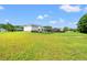 Expansive backyard featuring a fenced area, lush green lawn, and a gazebo perfect for outdoor entertaining at 307 Russ Rd., Loris, SC 29569