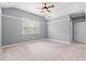 Bedroom with a ceiling fan, closet, and plush carpet at 307 Russ Rd., Loris, SC 29569