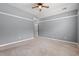 Bedroom featuring plush carpeting, neutral walls, and a modern ceiling fan at 307 Russ Rd., Loris, SC 29569