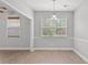 Cozy dining room with neutral color palette, natural light, and luxury vinyl plank flooring at 307 Russ Rd., Loris, SC 29569