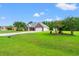 Charming single-story home featuring a brick facade, well-manicured lawn, and a two-car garage at 307 Russ Rd., Loris, SC 29569