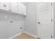 Functional laundry room with cabinets for storage and washer/dryer hookups at 307 Russ Rd., Loris, SC 29569