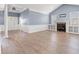 Bright living room with fireplace, built-in shelves, neutral walls, and luxury vinyl plank flooring at 307 Russ Rd., Loris, SC 29569