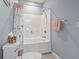 Clean bathroom featuring a shower and tub combination, with blue painted walls at 314 Black Oak Ln. # 102, Murrells Inlet, SC 29576