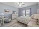 Comfortable bedroom with wood-look floors, soft furnishings, and natural light from windows at 314 Black Oak Ln. # 102, Murrells Inlet, SC 29576