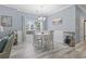 Dining area with natural light, a modern chandelier, and a wine rack at 314 Black Oak Ln. # 102, Murrells Inlet, SC 29576
