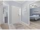 Bright entryway featuring a white front door, wood-look flooring, and easy access to the bedroom at 314 Black Oak Ln. # 102, Murrells Inlet, SC 29576