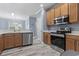 Well-equipped kitchen with stainless steel appliances, modern countertops, and wood cabinets at 314 Black Oak Ln. # 102, Murrells Inlet, SC 29576