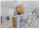 Bright kitchen features wood cabinets, stainless appliances and breakfast bar with seating at 314 Black Oak Ln. # 102, Murrells Inlet, SC 29576