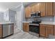 A kitchen view showcasing stainless steel appliances and white countertops at 314 Black Oak Ln. # 102, Murrells Inlet, SC 29576