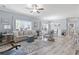 Open living space with dining area featuring neutral colors, wood-look floors, and lots of natural light at 314 Black Oak Ln. # 102, Murrells Inlet, SC 29576