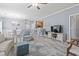 Spacious living room with a breakfast bar, open layout, wood floors, and neutral decor at 314 Black Oak Ln. # 102, Murrells Inlet, SC 29576
