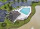 Community pool and pool house with ample deck chairs, and parking nearby at 314 Black Oak Ln. # 102, Murrells Inlet, SC 29576