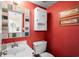 Charming bathroom features a unique mirror and warm red walls at 315 72Nd Ave. N # A, Myrtle Beach, SC 29572